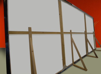 toile agrafé au dos sur chassis bois